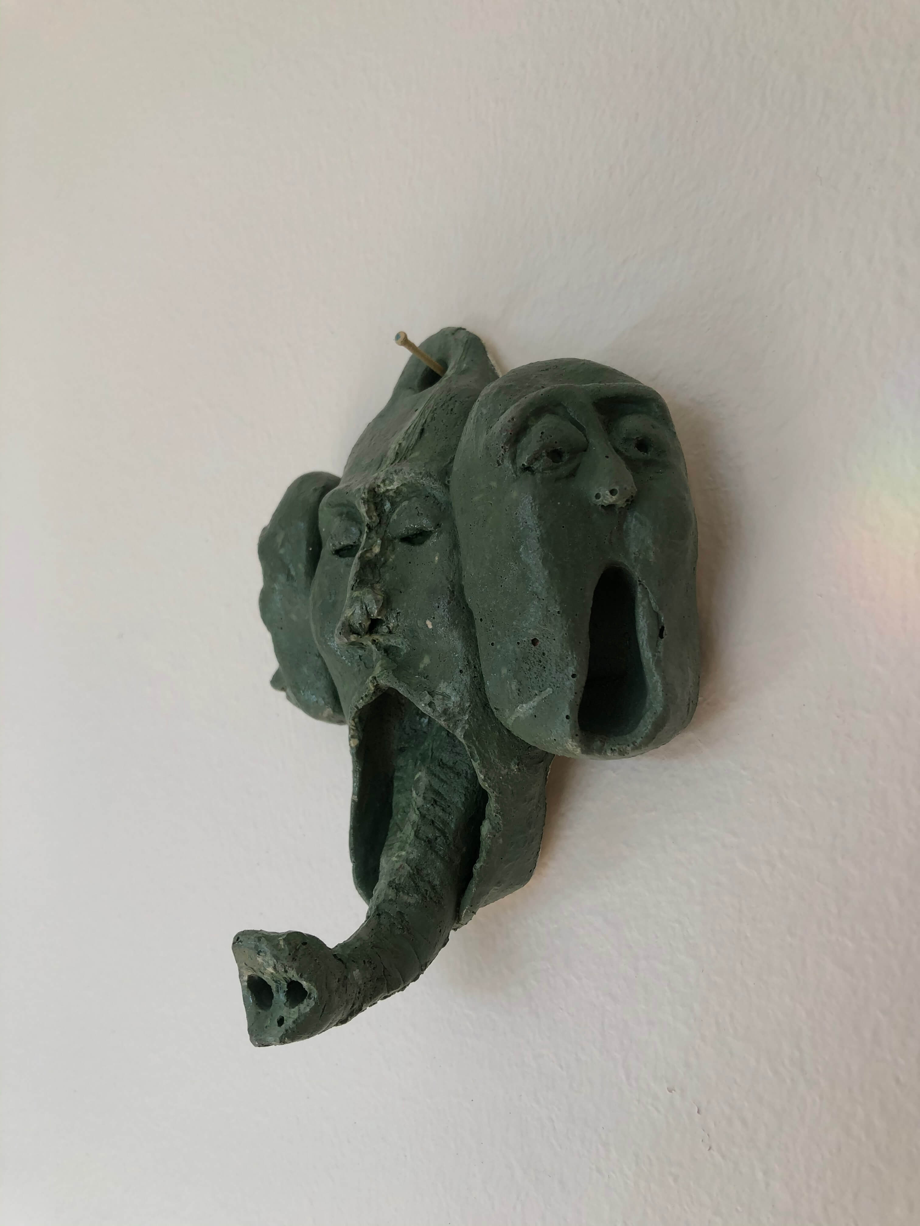 green elephant coat hanger from a different angle